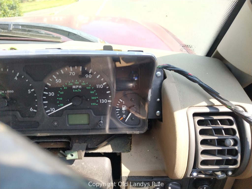 Discovery 2 dashboard clock cluster, with the surround removed, and showing the two right hand fixing screws