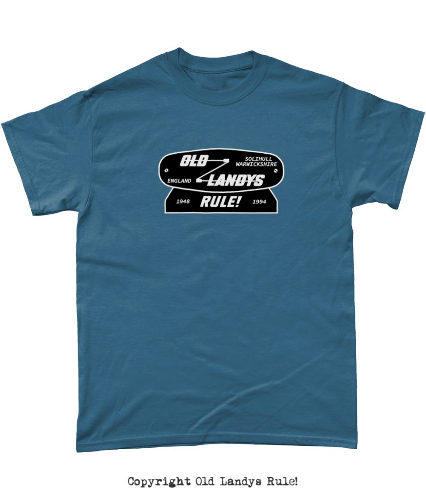 Mockup of a blue t-shirt with the Old Landys Rule! vintage logo printed on it, in silver and black.